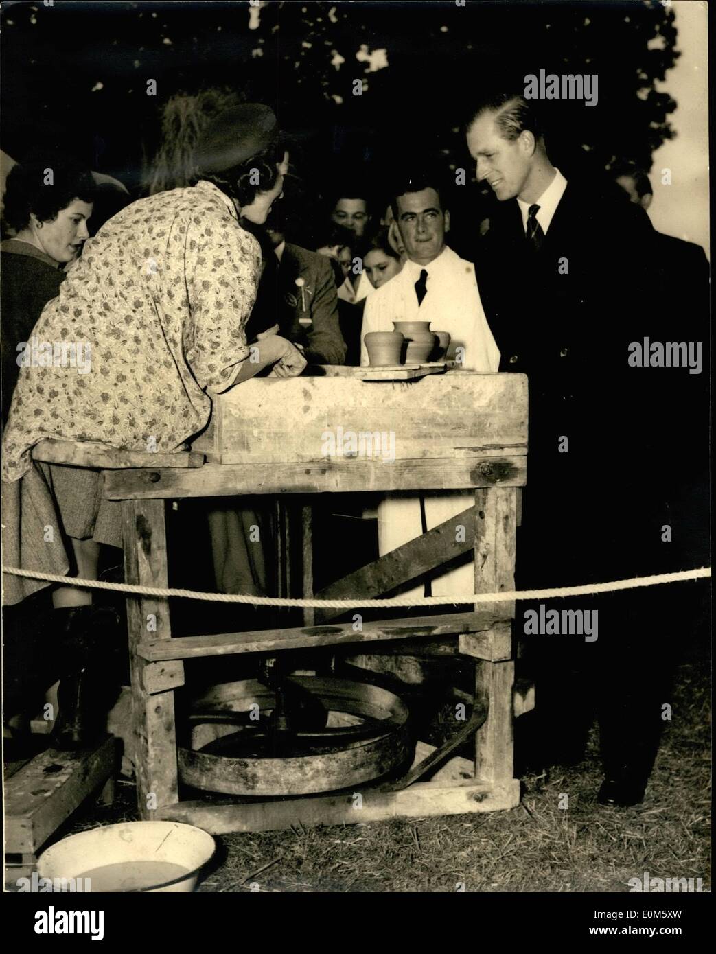 Oct. 10, 1953 - ''KEEP IT GOING'' SAYS THE DUKE. WITH A SMILE, THE DUKE OF EDINBURGH SAYS ''KEEP IT GOING'' TO 23-YEAR-OLD DAPHNE ENGLEFIELD OF WESTCOURT FARM, BRAY AS SHE DEMONSTRATED HER SKILL ON THE POTTERS WHEEL AT THE ROYAL EAST BERKS AGRICULTURAL ASSOCIATION'S ONE HUNDREDTH SHOW AT MOOR FARM, HOLYPORT, BERKSHIRE, TODAY OCTOBER 24TH. Stock Photo