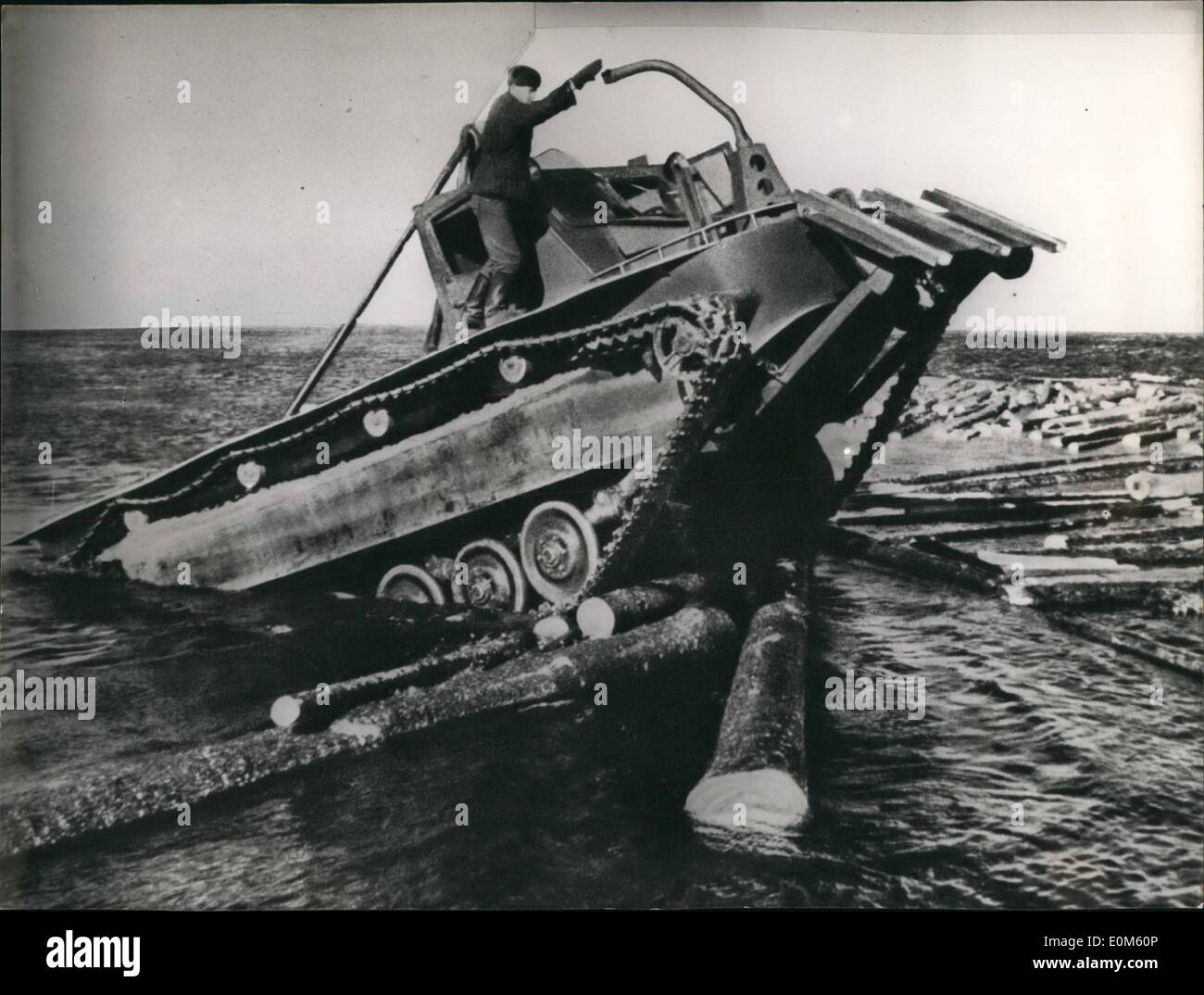 Oct. 10, 1953 - This is a very good implement for timber: Russia where there is plenty of wood developed this tractor lifting jack which works very well on land and also in water. It is able to do any rafting work wanted. With some slight changes the tractor may naturally be used also for purposes of war. Stock Photo