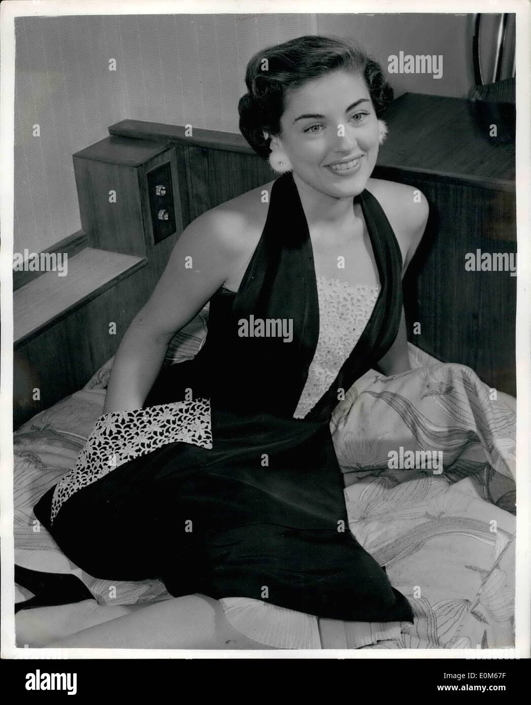 Sep. 09, 1953 - 3-D Actress Wears Mink Earnings: Photo Shows There's pride in her smile, The reason for it? Those tiny earnings Stock Photo