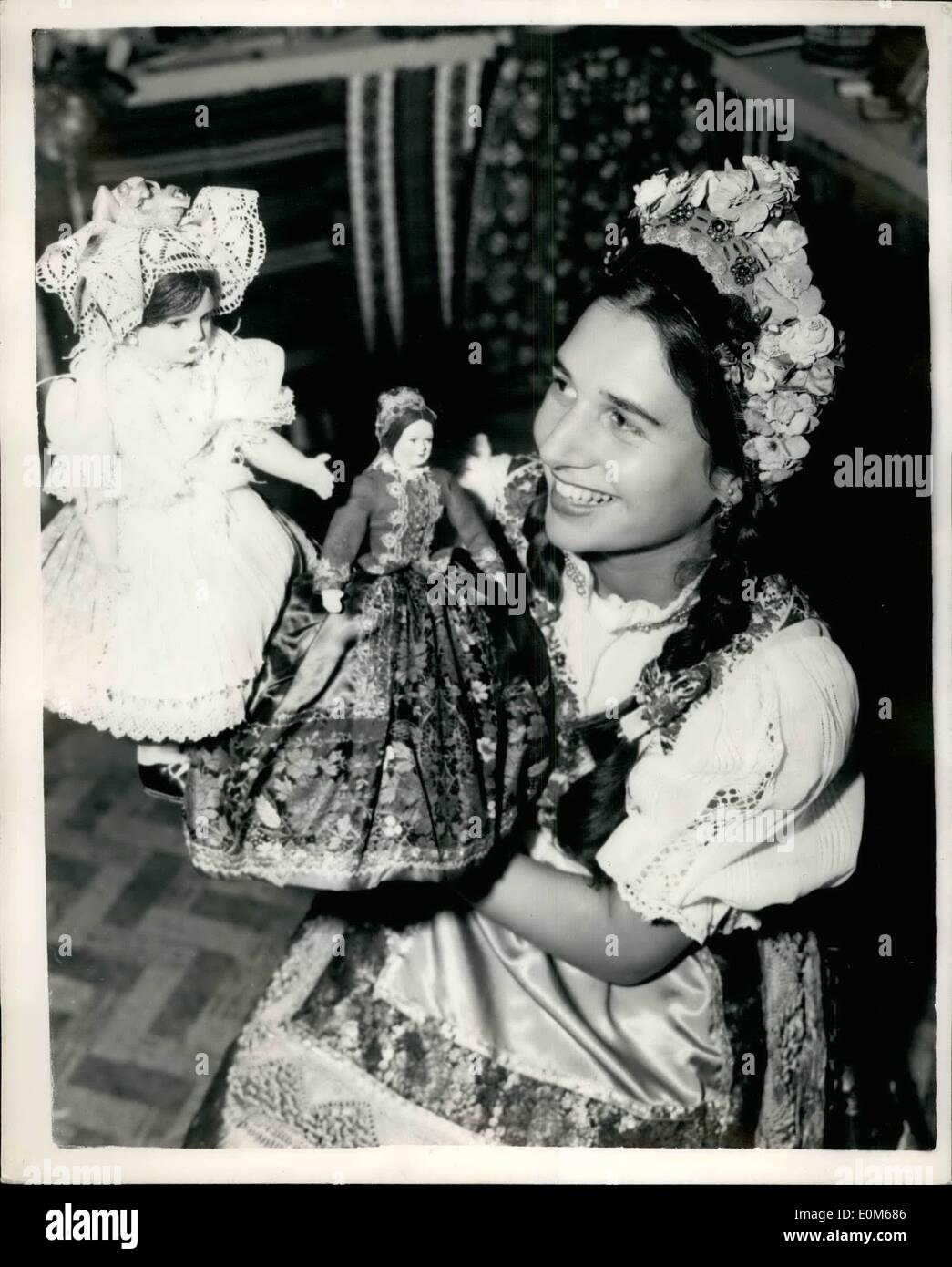 Sep. 09, 1953 - International Handicrafts Exhibition: The first International Handicrafts Exhibition ever held in Britain, opens tomorrow at Empire Hall, Olympia. A preview was held this afternoon. Photo shows Miss Edith Smookler, wearing Hungarian national costume, seen with two doll exhibits of the British Hungarian Friendship Society, on their stand at the exhibition today. Stock Photo