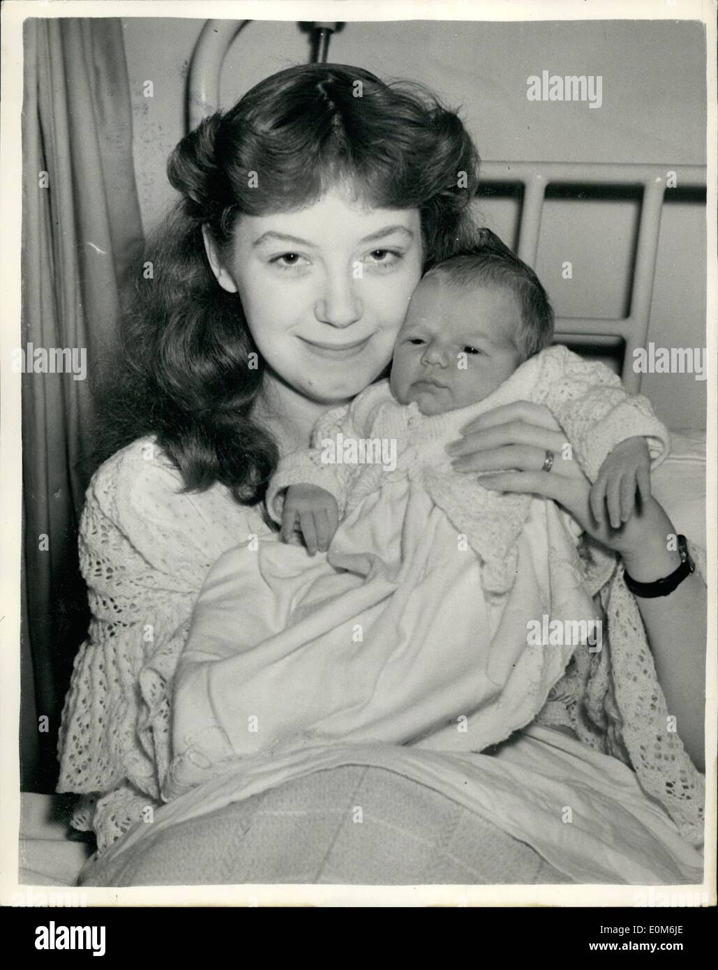 Oct. 10, 1953 - Beryl Introduces Her ''Own Younger Generation''.. ''Under Twenty'' Star And Daughter.. Beryl Roques of the B.B.C. ''Younger Generation'' - ''Under Twenty'' radio programme - was to be seen at the Alexandra Maternity Home, London, N.10. Introducing her four day old baby daughter which has been named Sherry, Beryl resigned from the programme - as she will be twenty-one on the day she comes out of hospital.. She is the wife of 24 year old radio-actor Richard Vosburgh, an American. Stock Photo