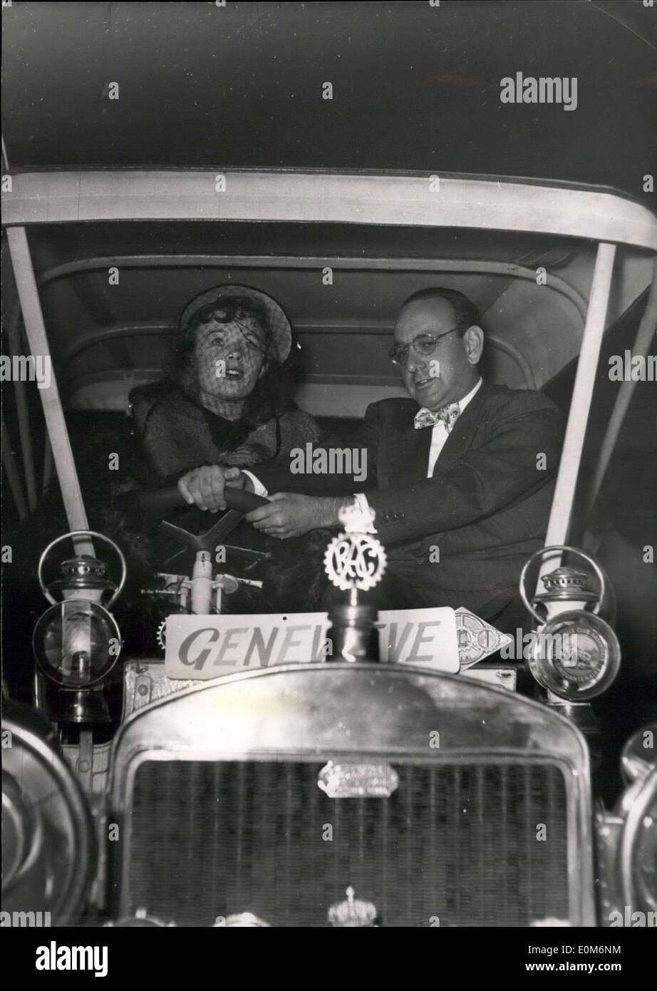 Oct. 30, 1953 - Henry Cornelius introduces ''Genevieve'': Henry Cornelius, producer of the famous film ''Passport to Pimlico'' at the wheel of an old taxicab ''Genevieve'' which will appear in his latest film ''Genevieve''. With him is the young star etchica chouro. Stock Photo