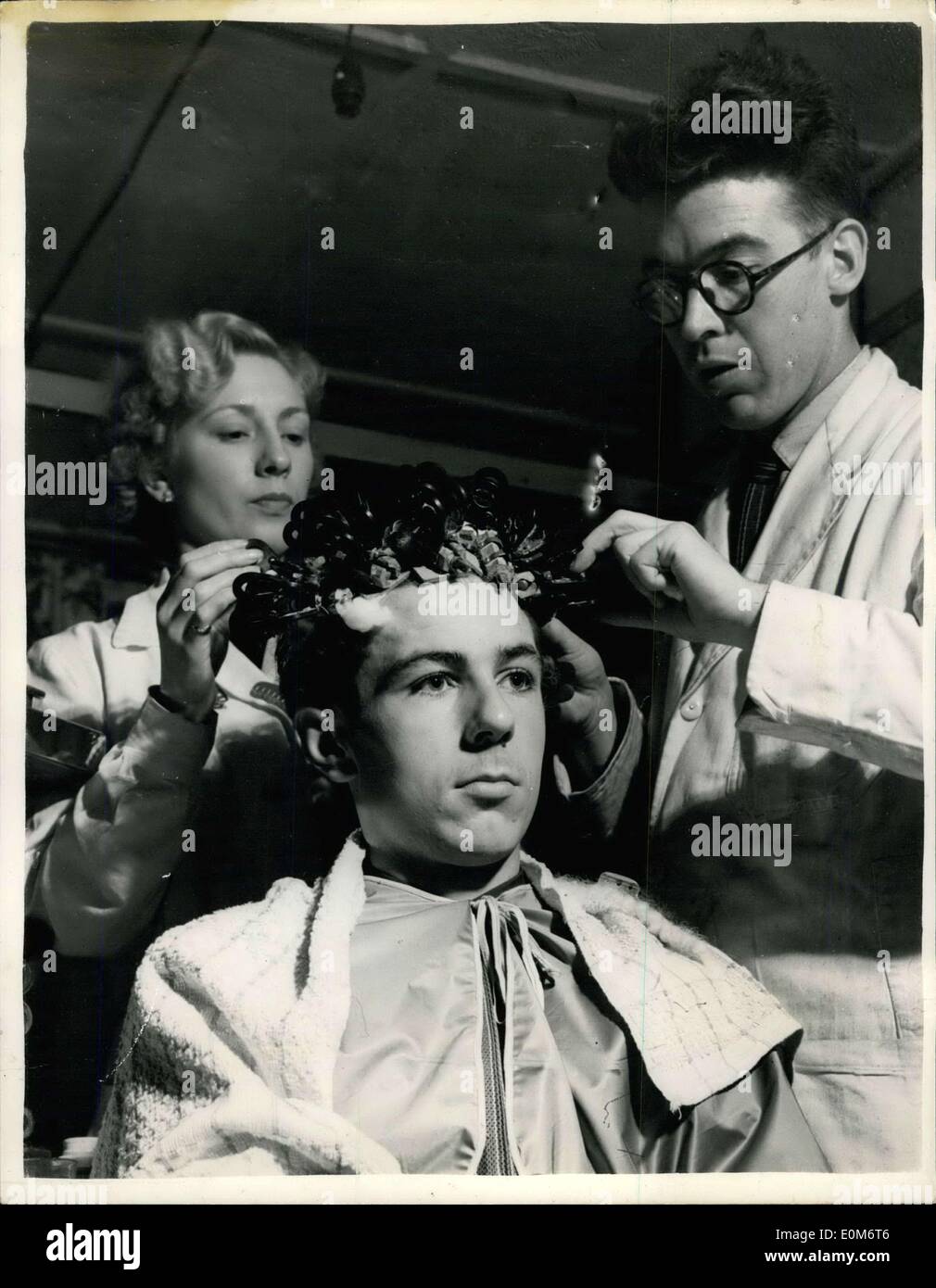 Sep. 14, 1953 - This Man's A Miner: Grimy and sweating Bob Shaw left the coalface at Clara Vale Colliery, County Burham. Then in the performed air of a hairdresser's parlous he relaxed and waited for ''Perm'', ''I want a Tony Curtis'', he ordered. For in the smart set of - Blaydon-on-Tyne you are no one if you don't look like Tyrone Power of Alan Ladd. Already the hairdresser has 15 regular male customers for film stars' hair-do's. It only costs 10s. said Bob. ''I earn a week at the pits so I can afford it. Stock Photo