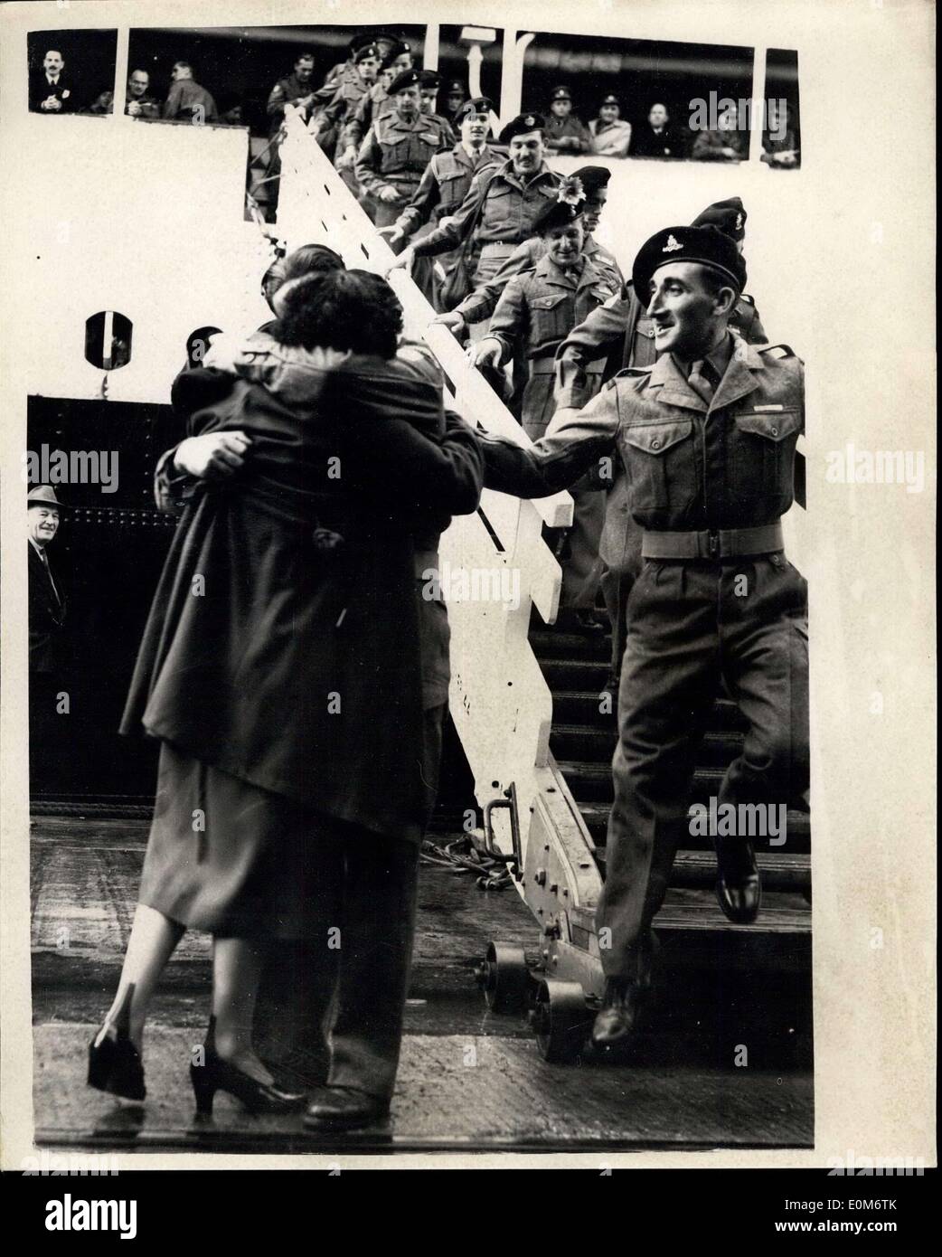 Sep. 16, 1953 - British Prisoners Of War Return Home. Troops Come Down Gangplank.. Photo Shows: No notice of the troops coming down the gangplank is taken by Private T.P. Nugent of the losters as he greets his wife Mrs. V. Nugent on arrival at Southampton today of Prisoners of war from Korea aboard the troopship Asturias.. They come from Edmonton, London. Stock Photo
