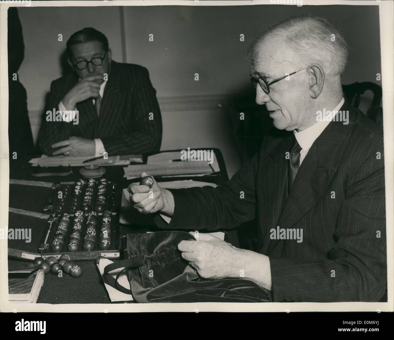 Nov. 11, 1953 - Draw for the first round of the F.A.Cup: Photo shows Alderman W.A. Harrap seen as he lifts the numbered balls-during the draw for the first round of the football association cup - held at the great western hotel, padding ton, this afternoon. Stock Photo