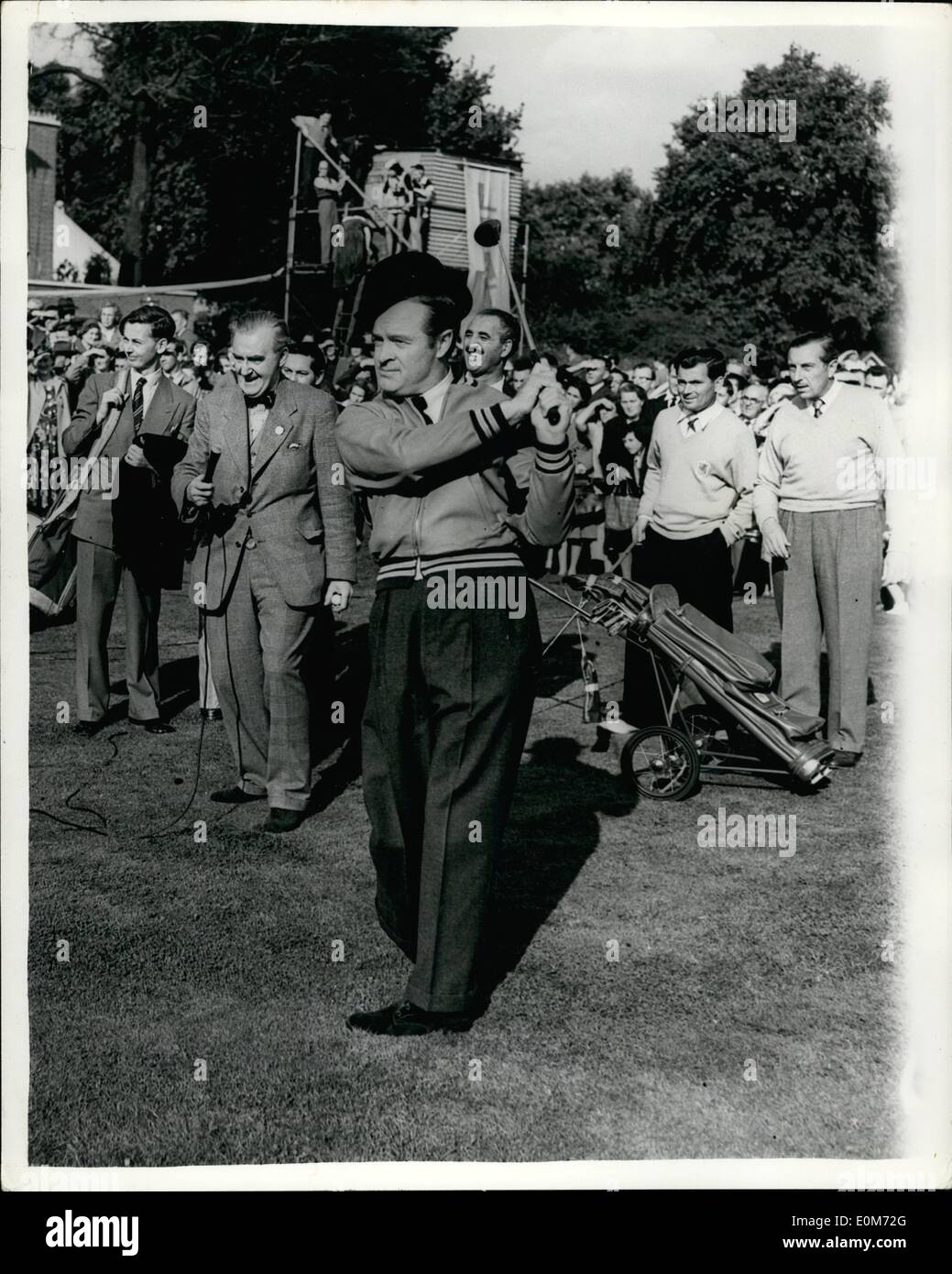 Sep. 26, 1953 - 26-9-53 Bob Hope complete with borrowed bowler. Hits perfect drive. Keystone Photo Shows: Comedian Bob Hope wearing a borrowed bowler hits a perfect drive watched by Dai Rees and Henry Cotton (right) when he Ã¢â‚¬Ëœgagged' the ancient game at the Battersea Fun Fair. It was all in fun and in aid of the National Playing Fields Association. Stock Photo