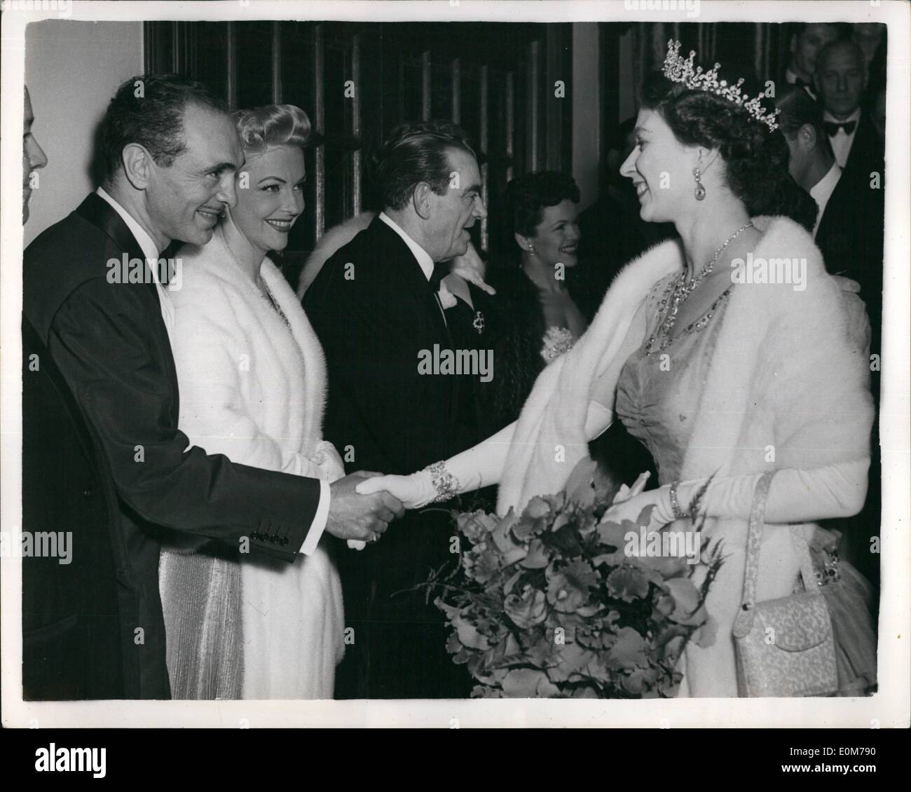 Nov. 11, 1953 - H.M. the Queen Attends Royal Variety Performance. H.M. the Queen, accompanied by the Duke of Edinburgh and Princess Margaret, last night attended the Royal Variety Performance of ''Guys and Dolls'', at the London Coliseum. After the performance, some of the artist were presented to H.M. The Queen. OPS: H.M. The Queen shaking hands with some of the artists. To be seen are Vivian Blaine, Jimmy James and on the right is Eve Boswell. Stock Photo