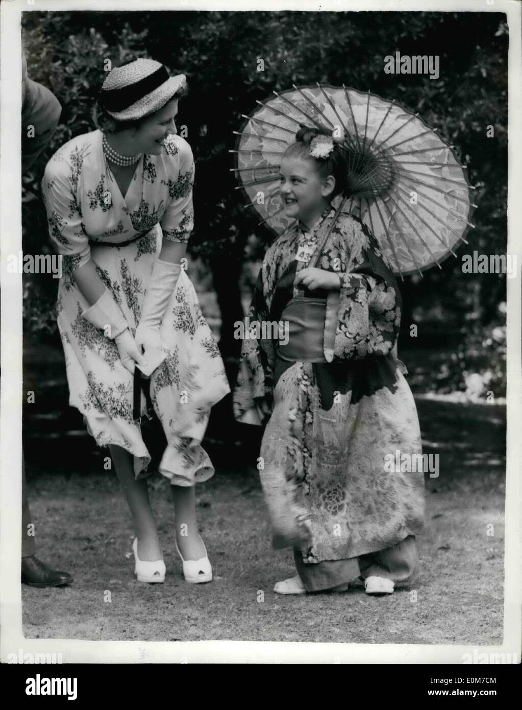 Oct. 10, 1953 - When East Meets West. There's admiration in the smile of Mrs. Christopher Soames, daughter of Sir Winston Churchill, as she inspects a gaily coloured Japanese outfit, complete with parasol.The outfit won a fancy dress prize at the Hastings and Rye Conservatives garden fete at St. Leonards, during the week end. Stock Photo