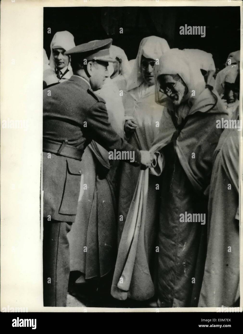 Jan. 01, 1954 - Demonstration In Streets Of Tetuan - Spanish Morocco...Protest Against Deposition On Sultan: Photo Shows Lieut Gen. Garcia Valino seen as he shakes hands with the Ulemas, Caids and Pashas who attended the gathering in the streets of Totuan, Spanish Morocco recently.They asked for ''Temporary Separation from French Morocco'' and full advertising for her Caliph Muley Hassan Under Spanish Protection.The demonstration was in protest against the deposing by the French of the Sultan Mohammed ben Yussef in favour of Sidi Mohammed Ben Arafa. Stock Photo