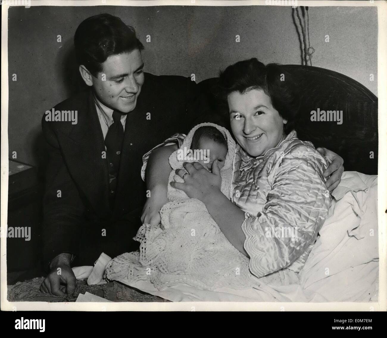 Jan. 01, 1954 - Geoff Duke and wife with their new years Eve Baby. Photo shows champion Motor Cycle racer Geoff Duke seen with his wife - and their baby son - who was born on New Year's Eve, at their Liverpool home. Stock Photo