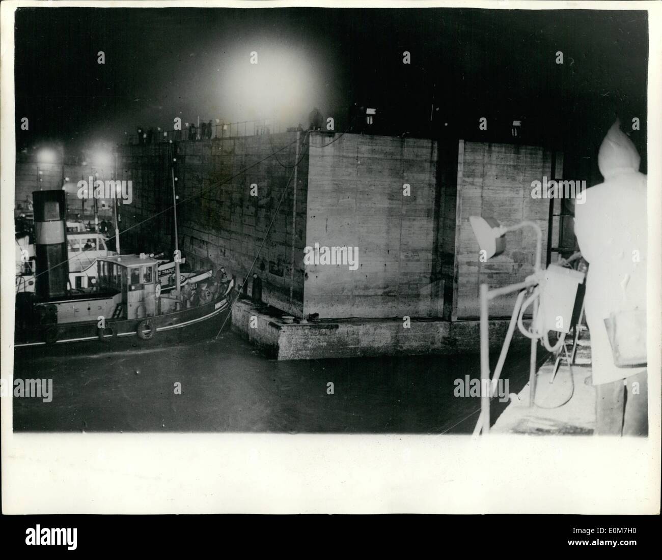 Nov. 11, 1953 - Holland closes the breeches. the final dykes are placed into position. Photo shows: Work goes on far into the night with the aid of flood lights - as the final caissons are placed into position at Ouwerkerk at the Isle of Schouwan. The placing of these caissons concludes the work that has been going throughout the Netherlands to repair the damages caused by the disastrous floods of February this year....Each of the caissons are about 60 metes in length. Stock Photo