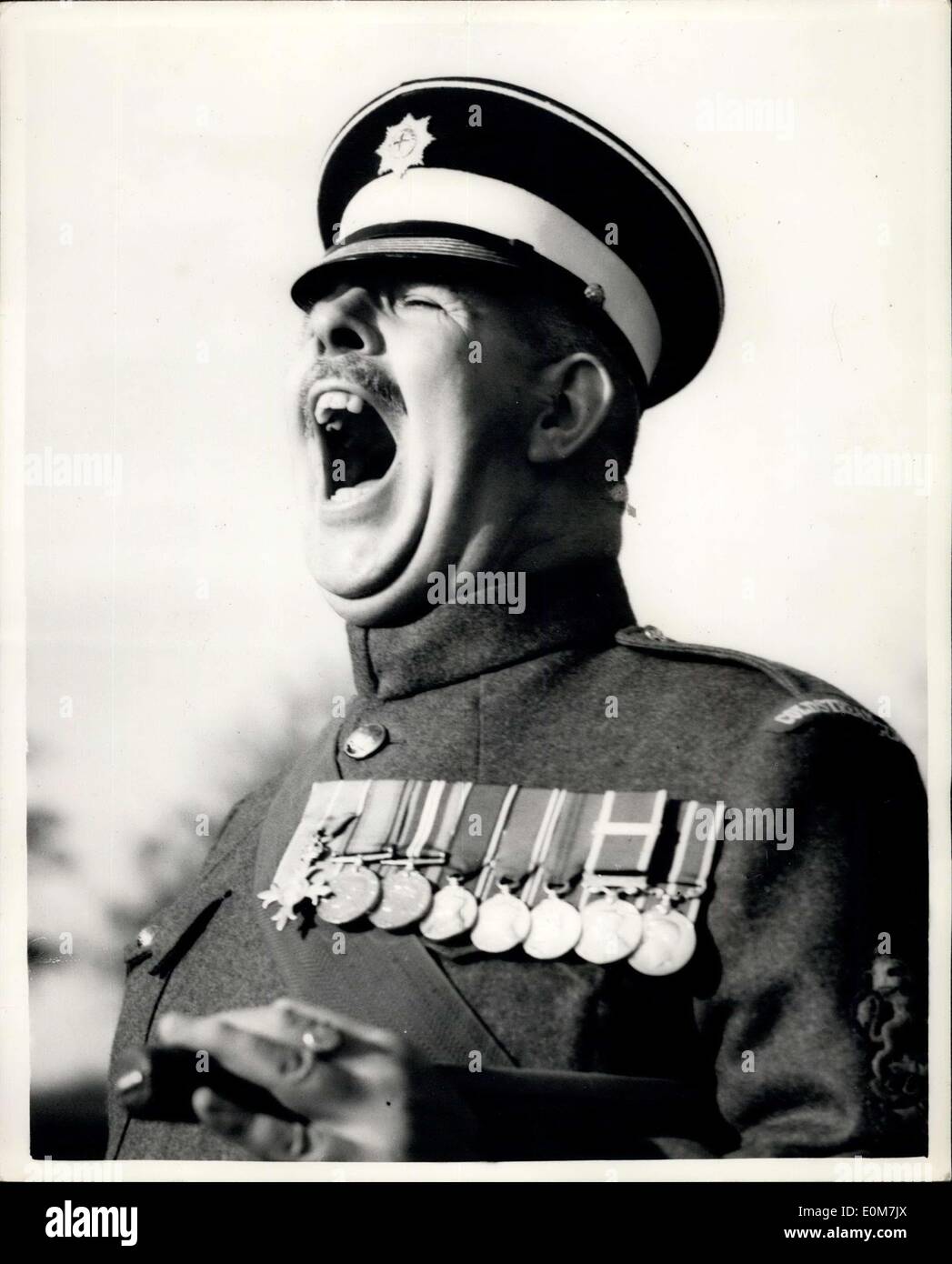 Nov. 19, 1953 - BSM Britain Receives Award.: Regimental Sergeant Major Ronald Brittain, Coldstream Guards, owner of ''the loudest voice in the British Army'', today received a bar to his Long Service and Good Conduct Medal. He has been in the Army 36 years. The presentation was made by Major General E.S.B. Gaffney, GOC Aldershot District, at a passing out parade at Mons Officer Cadet School, at a passing out parade at Mons Officer Cadet School, Aldershot. Photo shows RSM Ronald Brittain, wearing the bar - seen in typical mood at Aldershot today. Stock Photo
