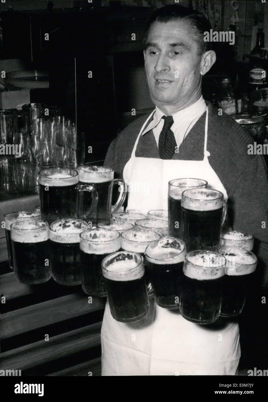Nov. 19, 1953 - World Champion of Carrying Beers. This title belongs to Viennese man Karl Schulz(pictured here). When Karl Schulz heard the announcement from America that a New Yorker, Max Semmler, was the world champion for carrying 16 beers and became incensed. Karl Schulz can carry 22. Stock Photo