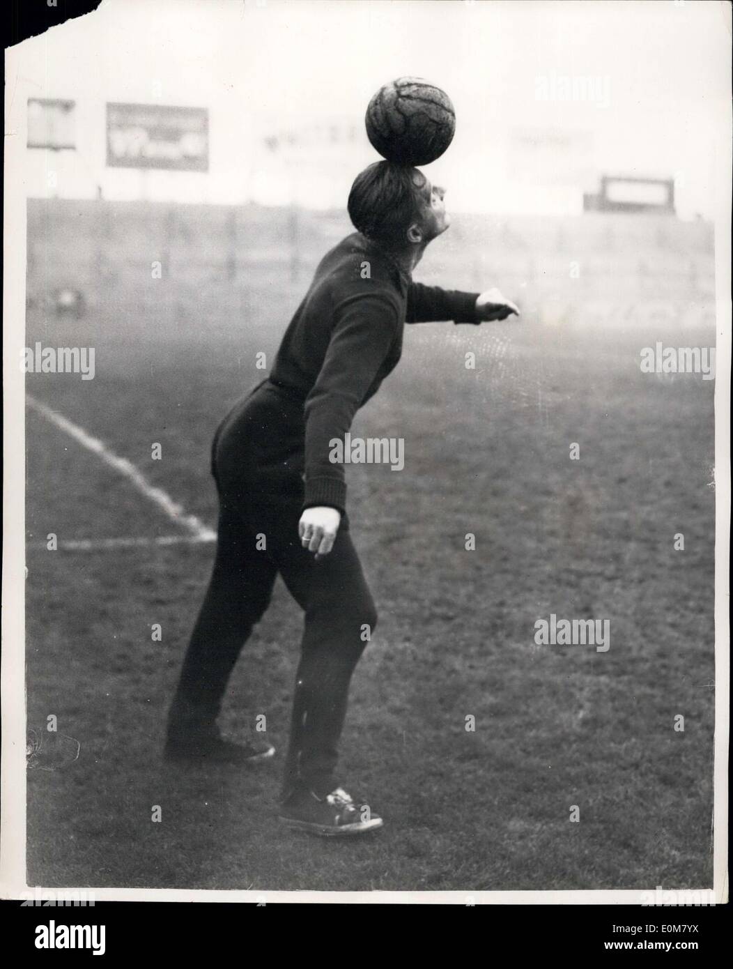 Nov. 24, 1953 - Hungarian Footballers IN Training.. Lorant Does A Balancing Act.. Members of the Hungarian Football Team which meets England at Wembley tomorrow were to be seen training at the Fulham Ground this morning. Photo shows Lorent of the Hungarian Team seen balancing a ball on his head - during training this morning. Stock Photo