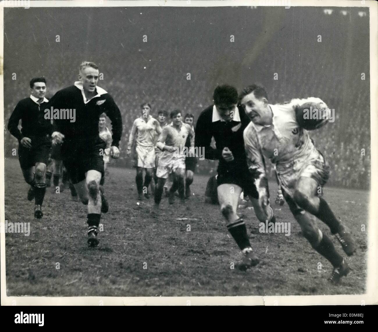 Feb. 02, 1954 - The All Blacks Beat Scotland 3 pts. to Nil.: The New Zealand Ruby Team - the all Blacks beat Scotland by 3 points to Nil - at Nurrayfield on Saturday. Photo Shows Grant weather stone making a strong bid to break away. Also seen is M.J. Dixon, who was injured in the tackle - during the match. Stock Photo