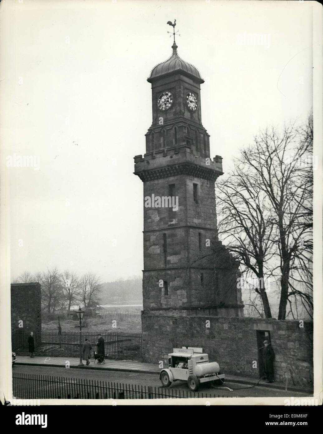 Jan. 01, 1954 - Gelignite Used To Destroy Ancient Steeple In Hamilton - Scotland: About 1,000 people, including many schoolchildren watched the destruction of the Old Tolbooth Steeple, in Muir Street, Hamilton, Scotland, recently - with the aid of gelignite charges. The steeple bell had tolled out the hours for 312 years - but the foundations of the steeple were eaten away and it menaced a nearby housing scheme. Photo Shows:- View of the steeple as preparations are made to set off the gelignite charges - to bring it down - in Hamilton, Scotland. Stock Photo