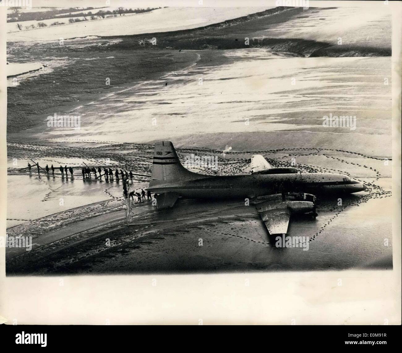 Feb. 05, 1954 - STRUGGLE TO SAVE THE GIANT ''BRITANNIA''.. SCENE FROM THE AIR.. Keystone Aerial View Shows:- View of the giant British Jet Aircraft - the 100 seater Britannia - as workers - R.A.F. personnel etc. struggled to release her from the mudbanks of the River Severn - in an unsuccessful race against the rising tides. Today Tanks are to be used to haul her on to dry ground.. The Britannia which cost ?100,000 to construct flew for the first time on December 23rd. She was piloted by Chief test Pilot Bill Pegg. Stock Photo