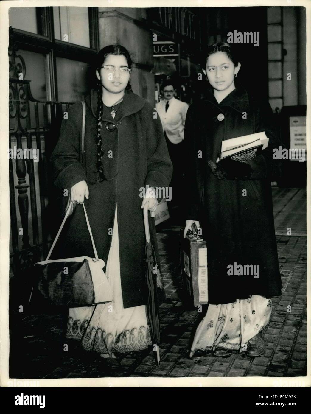 Feb. 11, 1954 - Suspended Girton Girl Students Arrive In London. The Indian girl students from Girton College, who were ''rusticated'' for four days were worried yesterday - about what their relatives in India will say. Anita Chakravarty said as she caught a train for London ''We don't want our people in India to hear about this. a suspension of this kind is viewed with greater gravity in India''. Miss Chakravarty and Miss Ranjana Ray were with four other students when two men undergraduates knocked on the window of a ground-floor room in the women's college after midnight Stock Photo