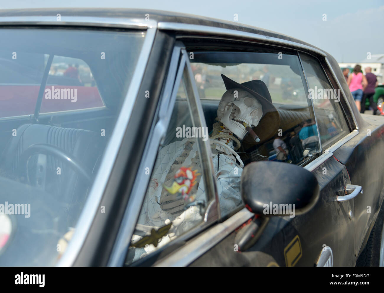 Hell Driver - skeleton in the drivers seat at Chatham Dockyard classic car show Stock Photo