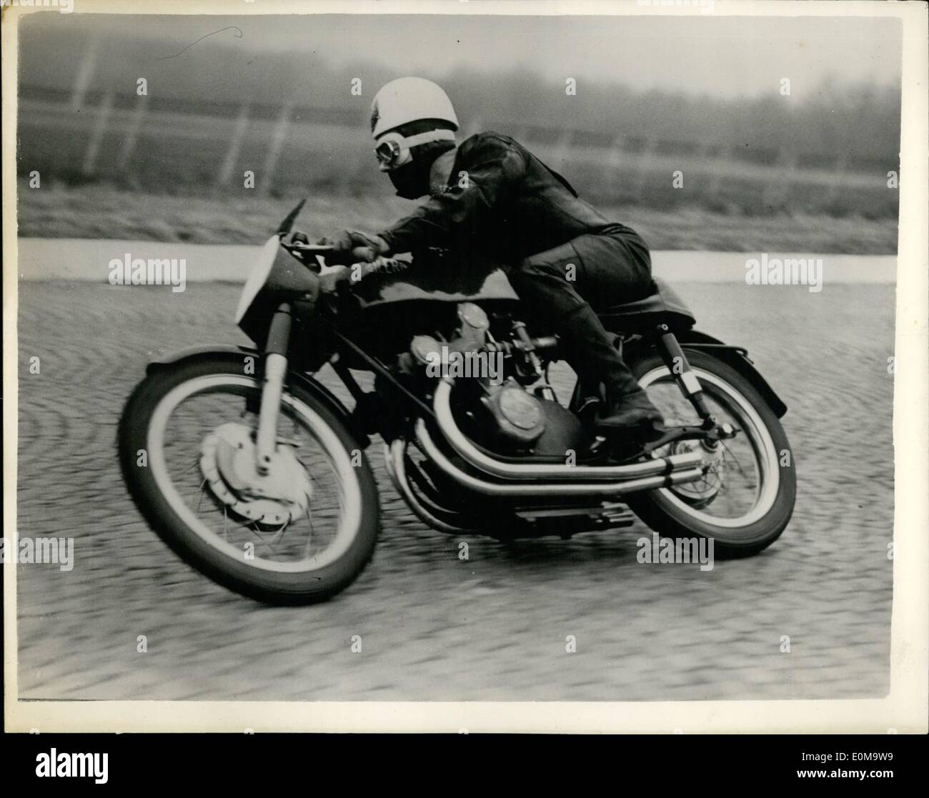 Mar. 03, 1954 - Geoff Duke tries out the new gilera. Bristish rider and Italian four cylinder machine: Photo shows Geoff Duke the famous British Motor Cycle ace - seen at speed when he tested out the new Italian 4 cylinder 500 c.c. Gilera machine at Monza. Stock Photo