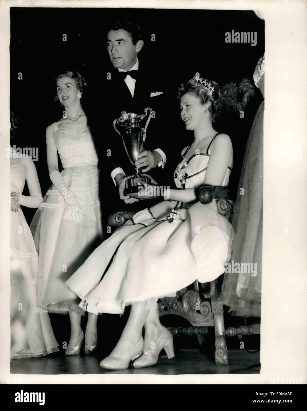 May 05, 1954 - National Ballroom Queen Contest: The grand finals of two unique contests were held in London last night, at the Empress Hall, Earl's Court. One was the national Ballroom Queen Contest and the other contest was for choice of the Football Queen of Great Britain. Keystone Photo Shows:- Miss Janet Ball, seen with Gregory Peck after she had been crowned winner of the National Ballroom Queen contest. Stock Photo