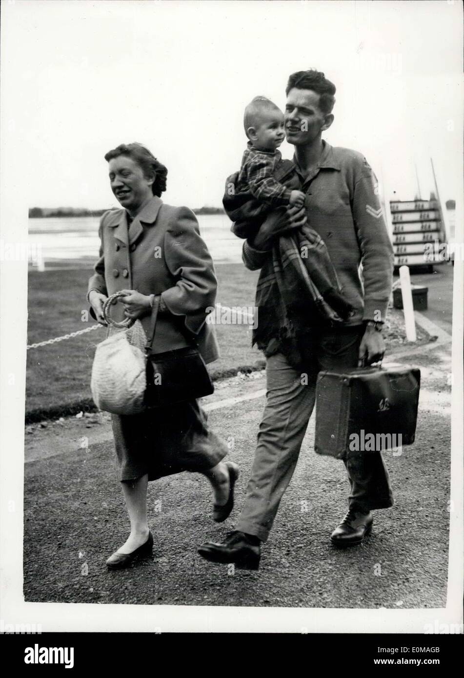 Mar. 31, 1954 - More Empire Windrush Survivors Arrive.: Serviceman and families - survivors of the ill-fated ''Empire Windrush'' landed at Blasckbushe this afternoon from Gibralter. Photo shows Bombardier Michael Boyd and his wife Dorothy with their daughter - fourteen months old Penny on arrival at Blackbushe this afternoon. They come from Billingshurst, Sussex. Stock Photo