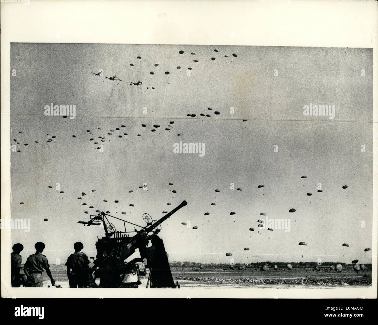 Apr. 04, 1954 - Indian Air Force Anniversary Display: An impressive paratroop drop was a feature of the Indian Air Force display, held recently at Tilpat, south of Delhi, to mark its 21st. Anniversary. Here are men of a Kumaon Regiment battalion being dropped by a large fleet of Dakotas. Stock Photo