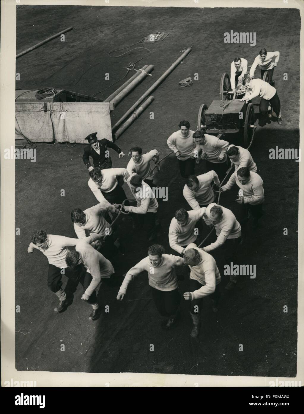 Apr. 04, 1954 - The Nore command Gunners prepare for the Royal Tournament : Men of the Nore Command are in training at the Royal Naval Barracks, Chatham, for the Field Gun Competition of the Royal Tournament. Photo shows Looking down on one of the Gun Crews hauling the completed gun and equipment during their training at Chatham. Stock Photo