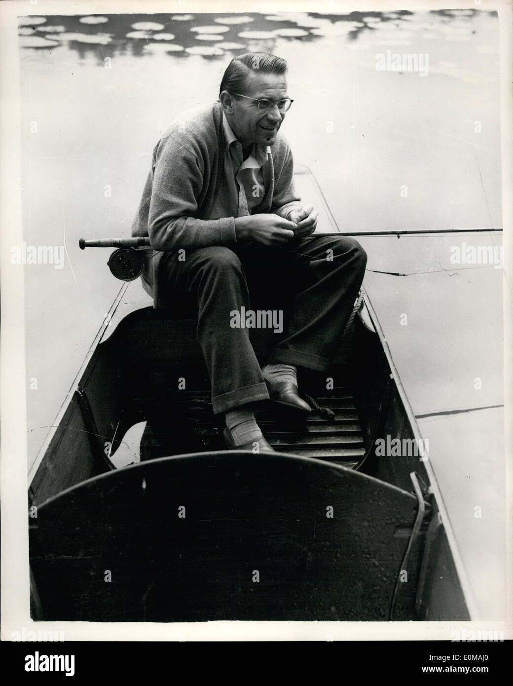 Jun. 30, 1954 - 30-6-54 Drobny relaxes. Jaroslav Drobny, who meets Budge Patty in the man's singles semi-finals at Wimbledon today seen fishing for carp from a part on the lake of his wife's family home in Surrey, yesterday. Stock Photo