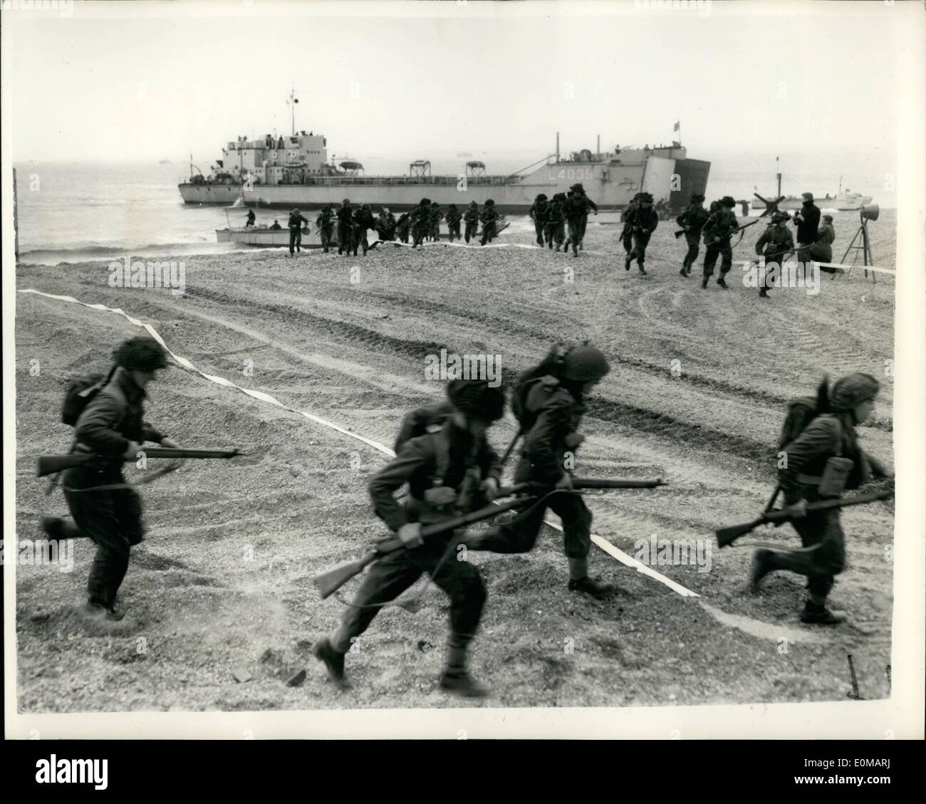 May 05, 1954 - Combine Forces Amphibious Demonstration. Runaground V, the annual amphibious and cliff assault demonstration staged for the benefit of the students of the Royal Navy, Army and Royal Air Force Staff Colleges, is taking place in the Solent Area today, tomorrow and Wednesday. Taking part are motor minesweepers, motor launched and tank landing craft of the Royal Navy, landing and raiding craft of the Royal Marines, R.N. and R.A.F. ir squadrons and strong R.M. and Army units Stock Photo