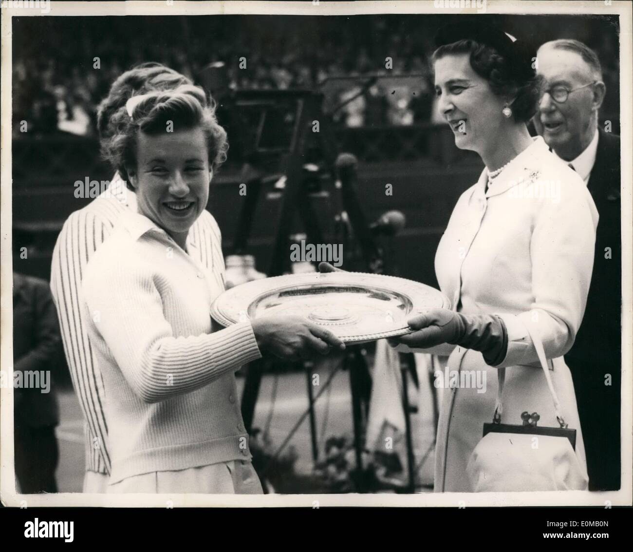 Jul. 07, 1954 - ''Little Mo'' wins ladies singles Title once again.. Beats Louise Brough at Wimbledon. Picture Shows: ''Little No'' Maureen Connolly receives the plate from the Duchess of Kent- after she had beaten Louise brough to retain the ladies Singles championship title at Wimbledoh this afternoon. Stock Photo