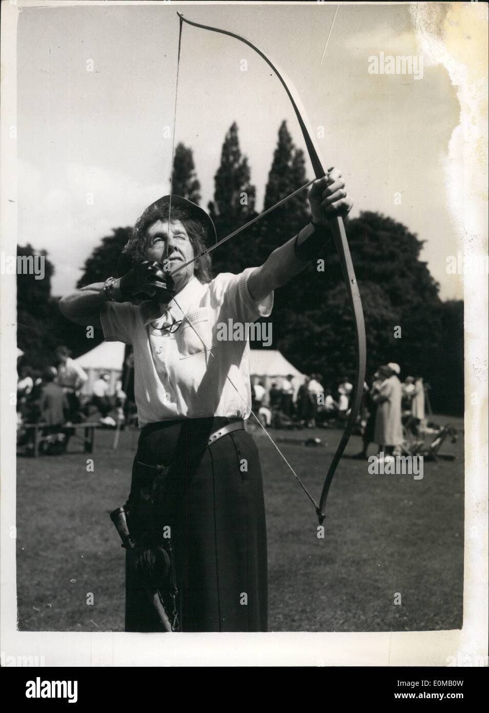 Jul. 07, 1954 - Archers hold their United Kingdom championships. The Eighty Eight year old Competitor: The United Kingdom Championships of the Grand National Archery society is being held in the grounds of Worcester College, Oxford. More than 200 are taking part in the meeting which is the 101st. National meeting. Photo shows the oldest competitor - Mrs. Hilda Overton (88) who comes from Liphook, Hants takes aim at the meeting today. Stock Photo