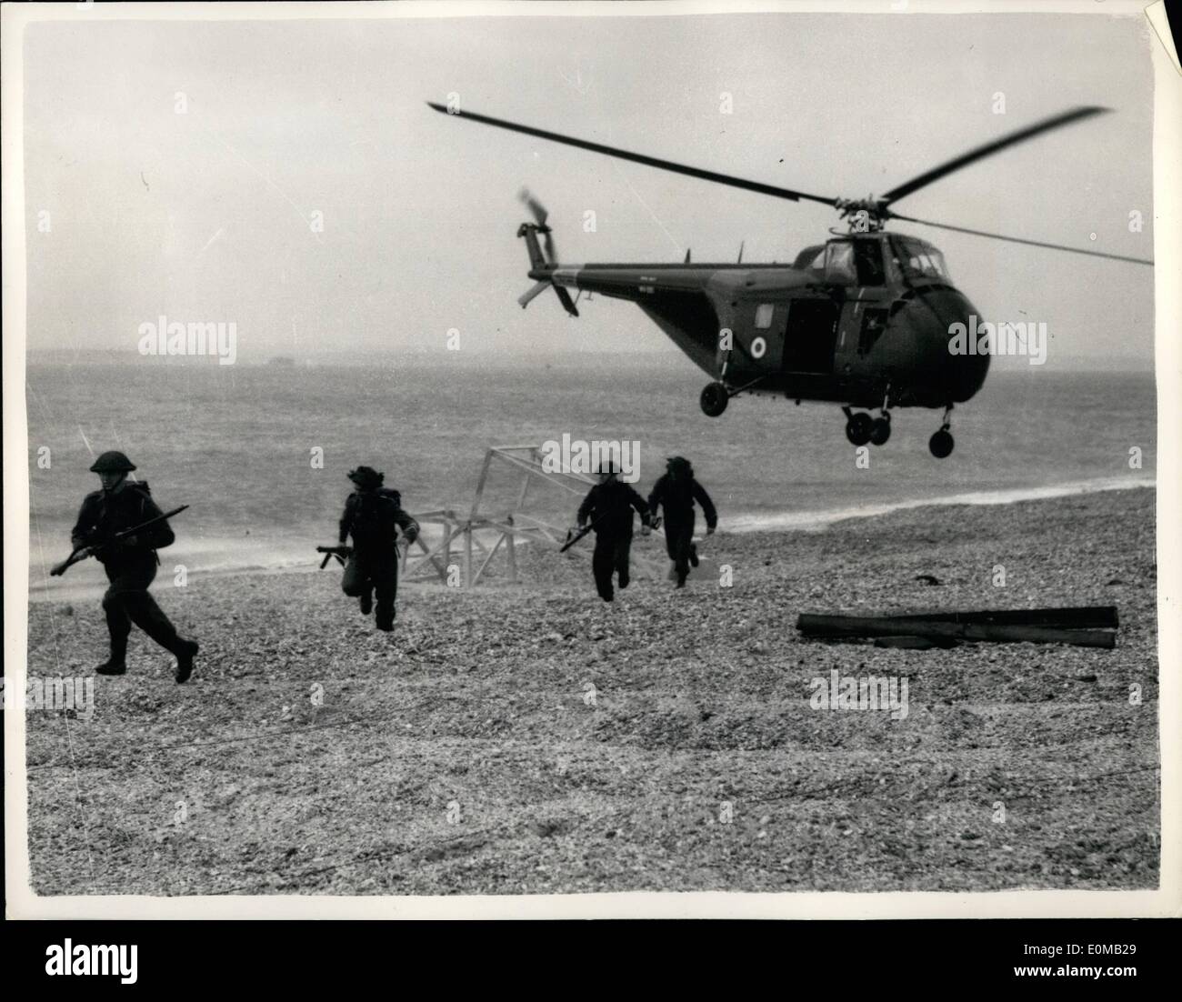 May 05, 1954 - Combined Service Amphibious Demonstration: Runaground V, the annual amphibious and cliff assault demonstration staged for the benefit of students of the Royal Navy, Army and R.A.F. Staff Colleges, is taking place in the Solent area today, tomorrow and Wednesday. Taking part are motor minesweepers, motor launches and tank landing craft of the Navy, landing and raiding craft of the Royal Marines, KR.N. and R.A.F. Squadrons, and strong R.M. and Army units Stock Photo