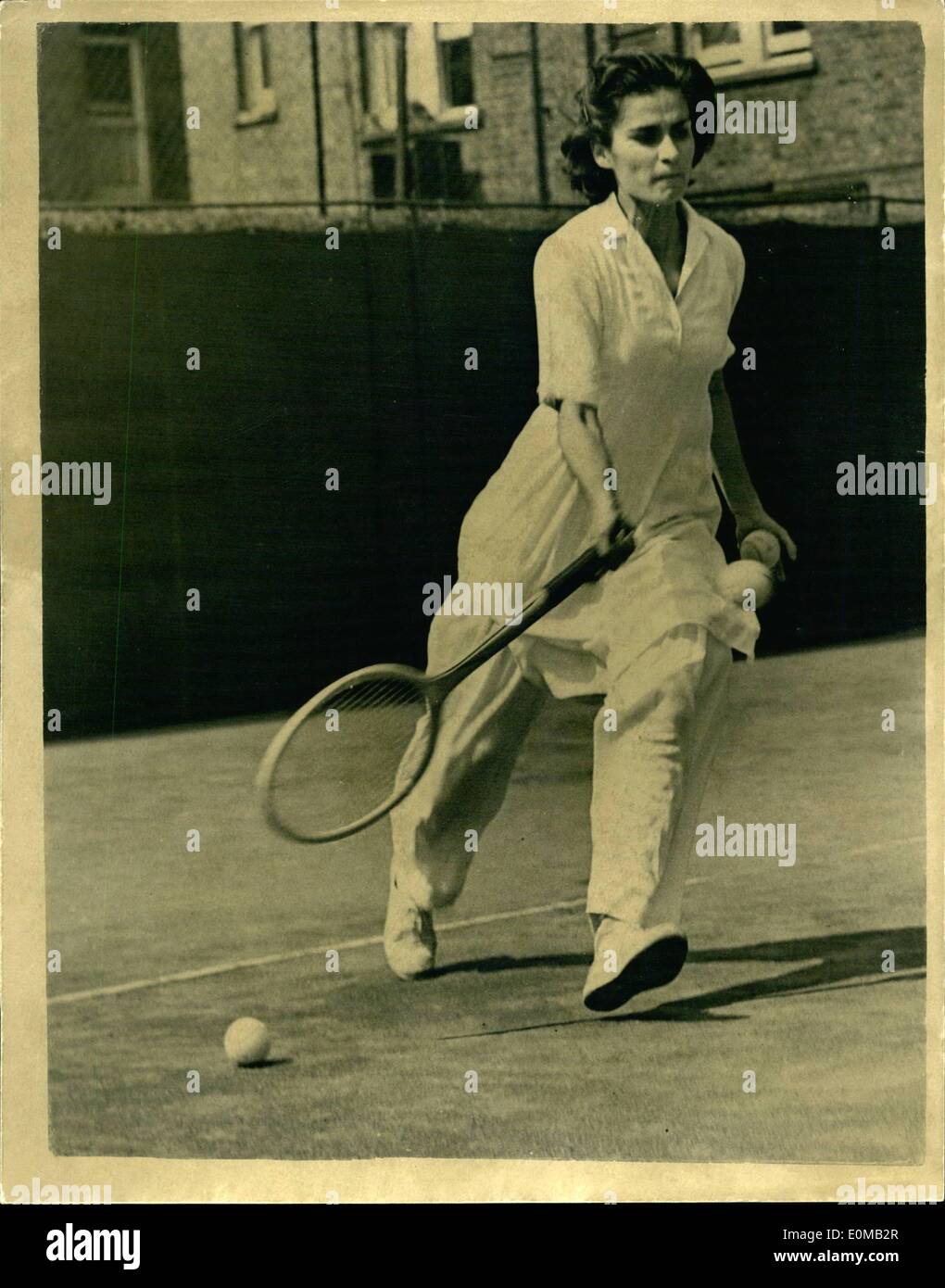 May 05, 1954 - Paddington Lawn Tennis Tournament. Player from Pakistan.  Keystone Photo Shows: Wearing long white trousers and a loose shirt, Miss  Perween Sheickh of Pakistan makes a short during her