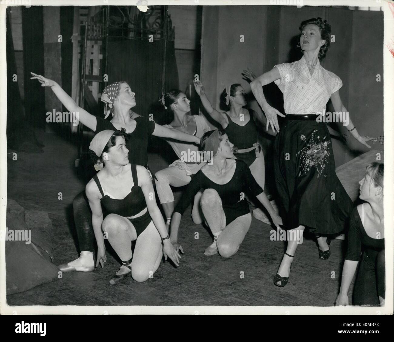 Jul. 07, 1954 - Titnia Dances In The Shearer Manner: Moira Shearer, film star, ballerina, and the wife of a successful now playwright, Ludovic Kennedy, began rehearsing at the Old Vic yesterday-for a production which that thetre will never see. It was ''A Midaummer Night's Dream'' produced by Michael Benthall, and designed for next month's Edinburgh Festival and a two -month American tour.Photo shows. Prima ballerina Miss Moira Shearer dance in a ''fairy'' ring during the rehearsal at the Old Vic yesterday. She takes the part of Titania-her first straight role. Stock Photo