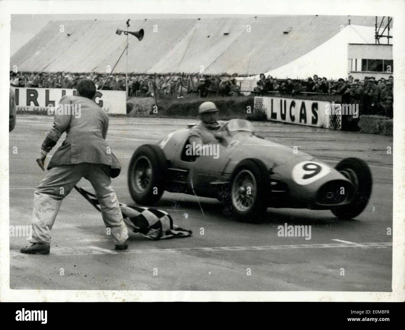 Jul. 17, 1954 - Gonzales Wins The British Grand Prix At Silverstone.. Crosses The Line.. Gonzalez the Argentine champion driving an Italian Ferrari won the British Grand Prix at Silverstone this afternoon.. Mike Hawthorn of Britain also driving a Ferrari came in second place.. Keystone Photo Shows:- Gonzalez is flagged across the line - when he won the race at Silverstone this afternoon. Stock Photo