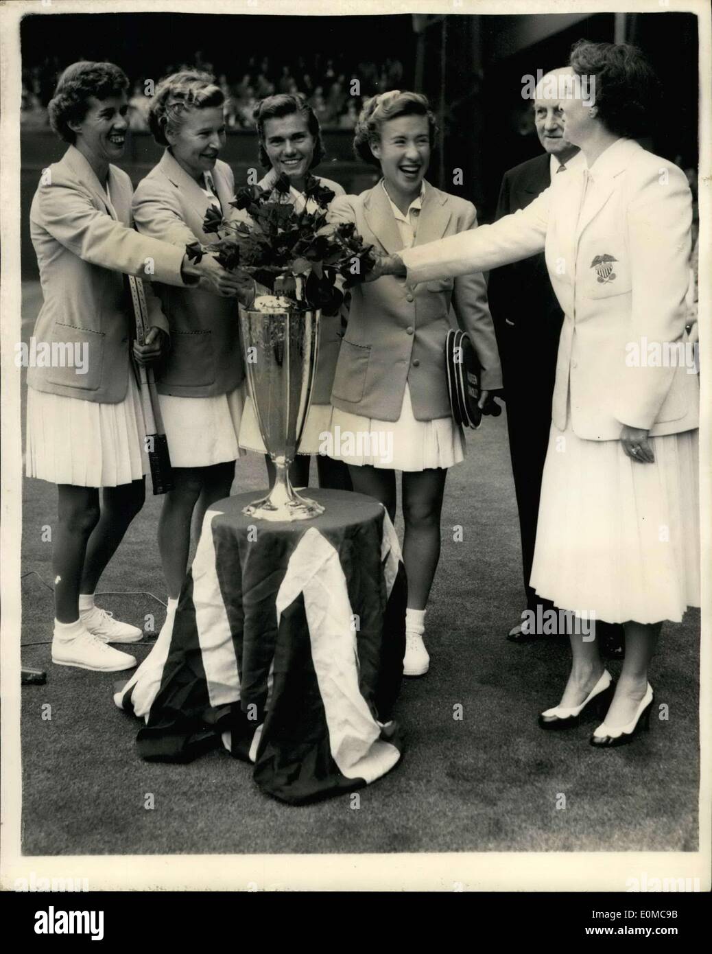 Jun. 12, 1954 - Wightman Cup At Wimbledon: Photo shows. Smiles of victory from players after their victory at rain soaked Wimbledon today. Lord TEmplewood, who presented the trophy is seen with (left to right), Doris Hart, Louise Brough, Shirley Fry, Maureen (Little Mo) Connolly, and Mrs. Du pont (Captain). The American girls gained the Cup by winning the first much today. Stock Photo