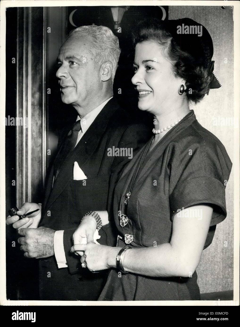 Aug. 21, 1954 - Actress Joan Bennett And Husband Walter Wanger Arrive In London.: Film producer Walter Wanger and his wife, actress Joan Bennett arrived in London today by air. It is their first visit together since he shot and wounded her hollywood agent Jennings Lang three years ago. After the shooting they separated. Now Happily reunited they will go to the Edinburgh Film Festival for the showing of Wanger's film ''Cell Block 11''. It grew out of his own term in prison for the shooting Stock Photo