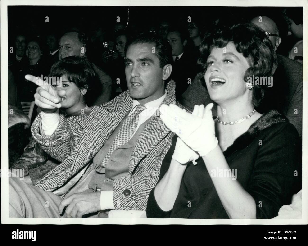 Sep. 09, 1954 - Rome/American actor Jacques Bergerac enjoies at Circus with his wife actress Dorothy Malone last night. at left, besides them is miss Maria Scicolone Sister of movie star Sophia Loren. Stock Photo