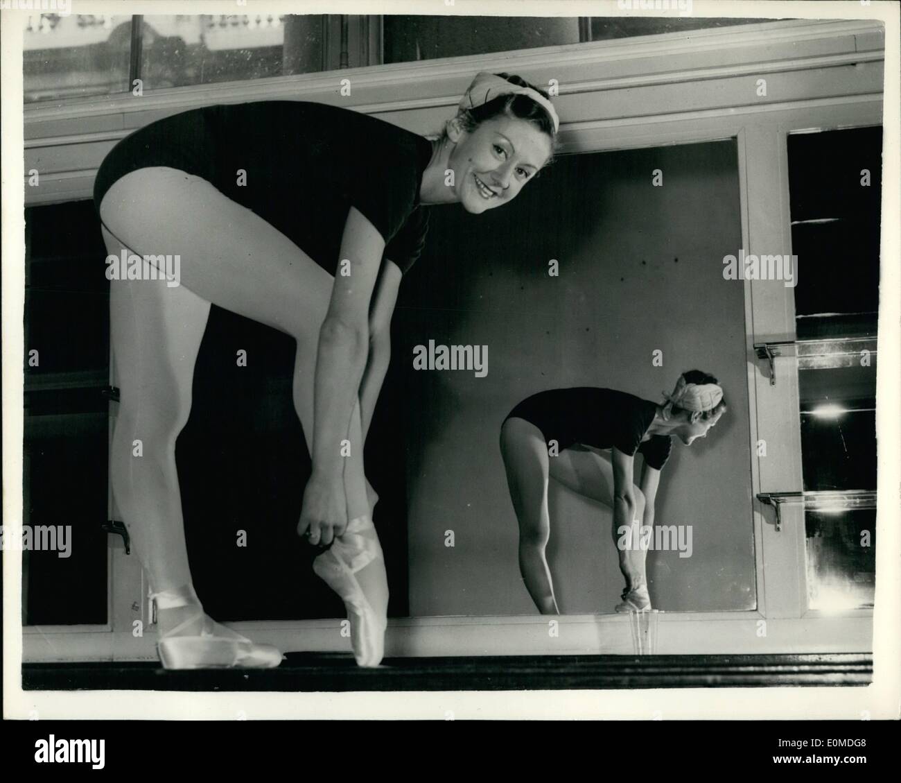 Sep. 09, 1954 - PARIS OPERA BALLET REHEARSE Members of the Parrs Opera Ballet eare today rehearing at Covent Garden for the opening tonight of their two-veeke season. one of the principle dancers - Madeleine Lafon limberring up in front of a mirror - before today,s rehears Stock Photo