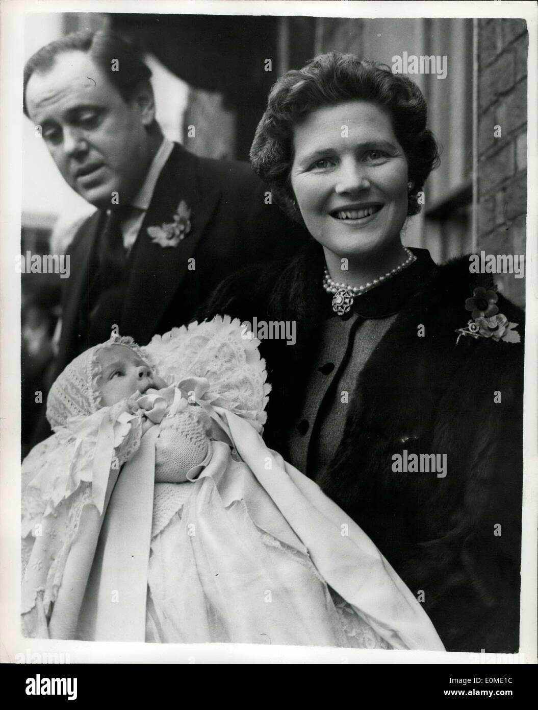 Nov. 06, 1954 - Sir Winston Churchill Attends Christening of his Ninth Grandchild.: Sir Winston Churchill today attended the christening at Westerham Parish church, of his ninth grandchild - the baby daughter of Captain and Mrs. Christopher Soames (the former Mary Churchill). The baby was named Charlotte Clementine. Their three other children, Jeremy, Emma and Nicholas were present. Photo shows Captain and Mrs. Soames, with their baby daughter, Charlotte Clementine, after today's christening. Stock Photo
