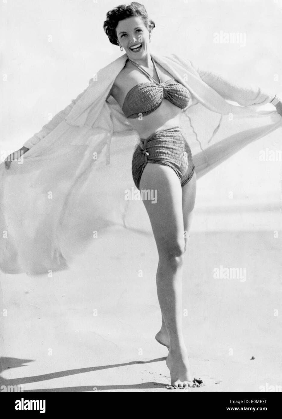 Actress Jane Russell on the beach during a charity tour Stock Photo - Alamy