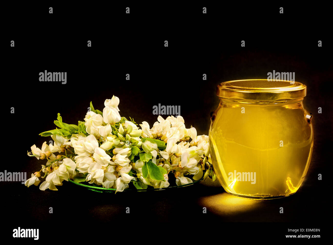Pure acacia honey is very popular and coveted. Stock Photo