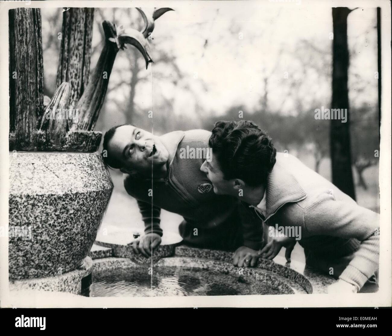 Nov. 11, 1954 - German Footballers in London Take a drink in the Park: Members of the German Football team who arrived in London today for their match with England on Wednesday - were to be soon out in their track suits soon after their arrival. Photo shows Gerd Harpers(drinking) - and Werner Kohlmeyer take a drink from a fountain - during their ''Limbering-up'' visit to the Park this morning. Stock Photo
