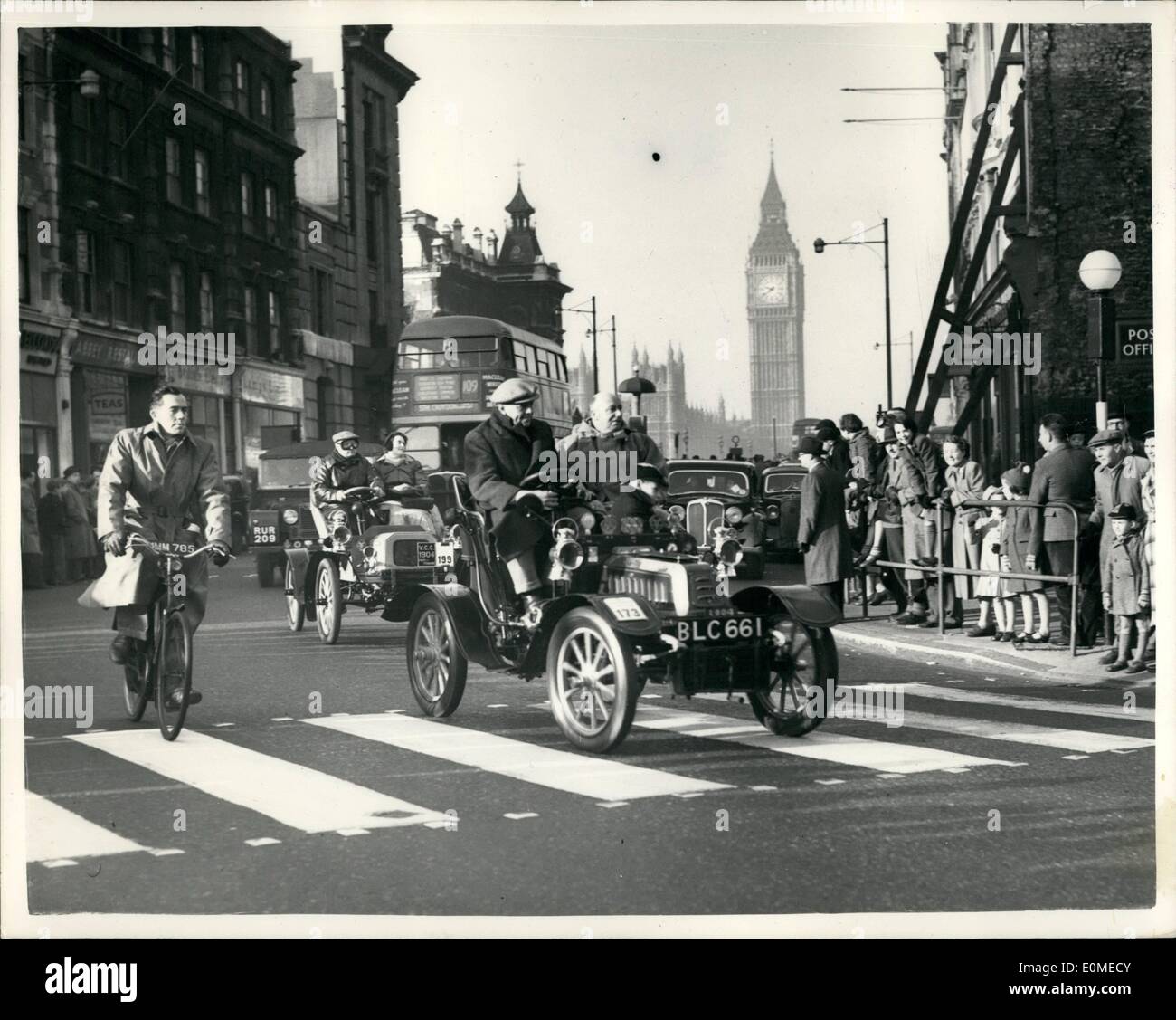 Nov. 11, 1954 - London To Brighton Veteran Car Run. The Royal Automobile Club Veteran Car Run from London to Brighton took place today. The Run. organised by the Royal Automobile Club in conjunction with the Veteran Car Club of Great Britain, started this morning from Hyde Park. Keystone Photo Shows:- A 1904 Dedion Bouton, followed by a 1904 Pope-Tribune, seen cornering after crossing Westminster Bridge. Stock Photo