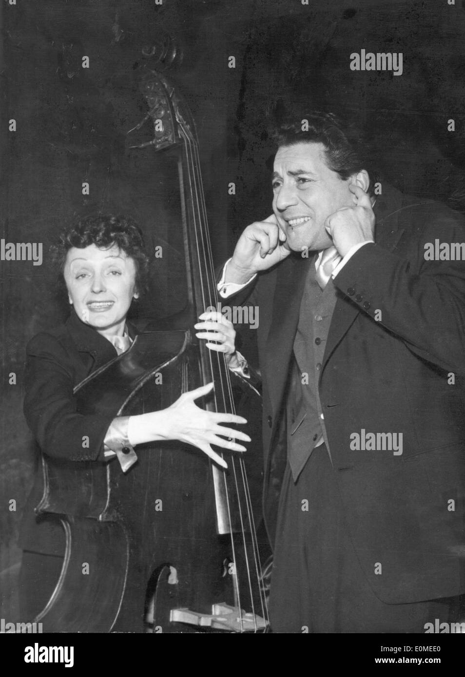 Singer Edith Piaf plays cello with husband Jacques Stock Photo