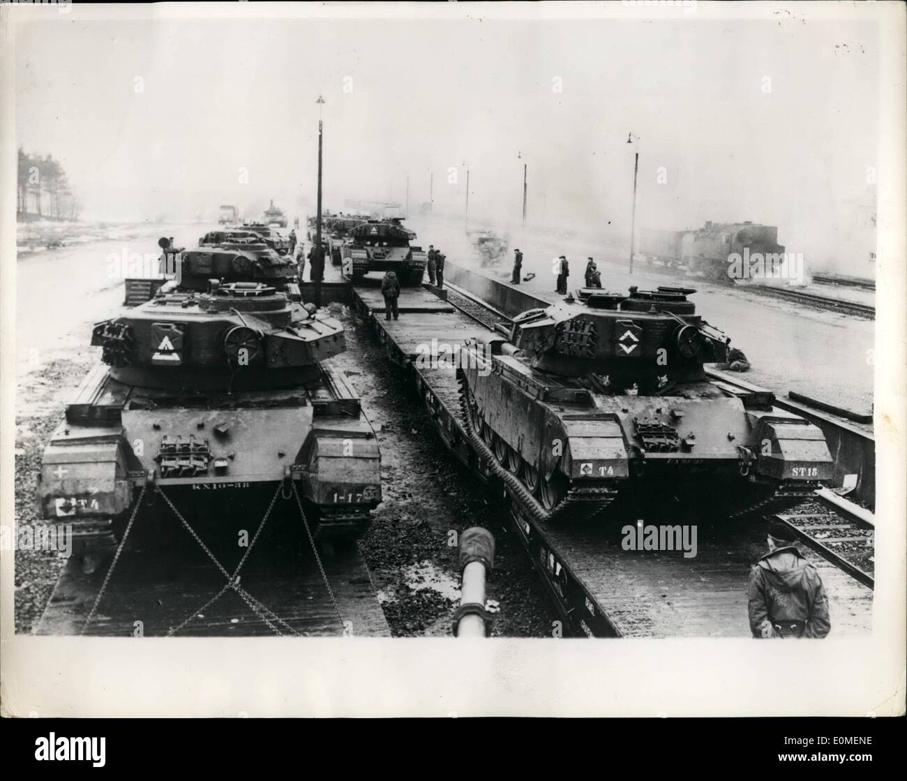 Feb. 02, 1955 - Tank Battalion Under Training at Belsen-Horne Germany..: The 1st. Squadron of the 4th. Heavy Tank Battalion 1st. Netherland Corps came from Holland by train for training at the B.A.O.R, Tank Gunnery Range at Belsen-Hohne, Germany recently.. They were replaced by another squadron of their battalion. This B.A.O.R Range is the largest in Europe and is used by armoured units from many N.A.T.O Nations. Photo shows The 50 Ton Centurion Tanks being driven on to the Railway wagons which will return them to Holland. Stock Photo