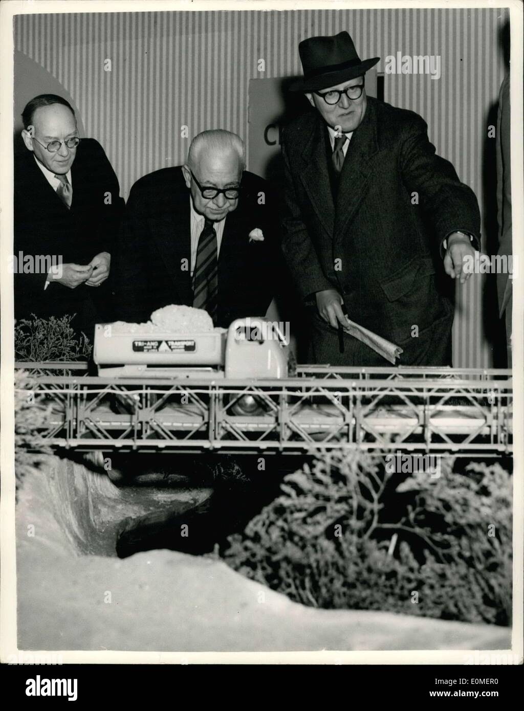 Nov. 18, 1954 - Inventory of Bailery Bridge At Exhibition; Sir Donald Balley, the billiant wartime inventor of the Bridge - today visited the Public Works and Municipal Services Exhibition, at Olympia. Photo Shows Sir Donald Bailey seen pointing out the structure of a model Bailey Bridge, to Major J.A.L. Thomas, Chairman of the Exhibition (centre), at the Exhibition today. Stock Photo