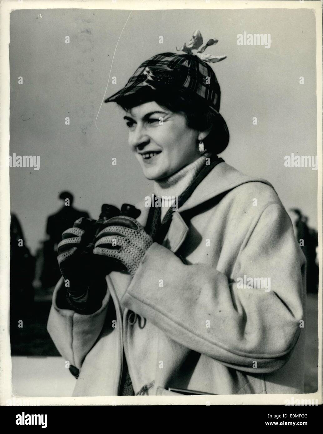 Dec. 12, 1954 - Boxing day car race meeting at brands hatch. The lady with the deer-stalker hat. Photo shows Diana Aley of Cambridge wears a deer - stalker hat in Scottish Tartan and earrings of the Bugutti car radiator - an a duffle coat - during the Boxing day car race meeting at Brands hats today. Stock Photo
