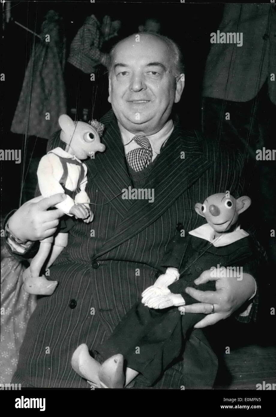 Mar. 03, 1955 - Czechoslovakian Puppets Shown in Paris. Josef Stuka with two of his puppets during a rehearsal at the Etcile Theatre Paris where the Puppet Show will start tomorrow Stuka is touring Europe with a theatre of fifteen puppets and 35 technician to help him. Stock Photo